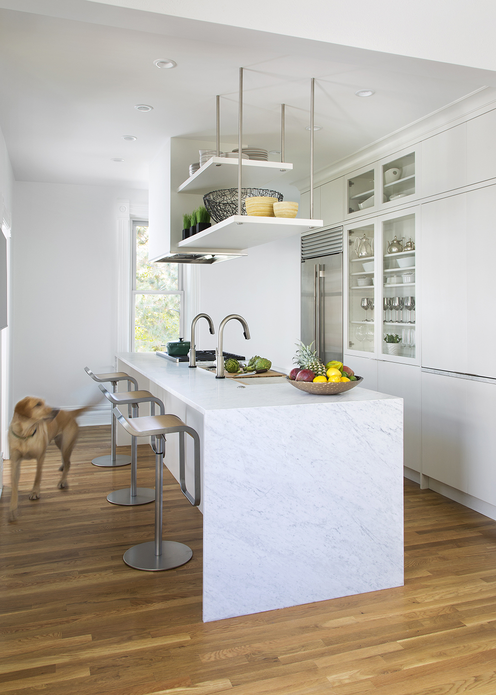 Custom kitchen design with white features by William Ohs in Denver