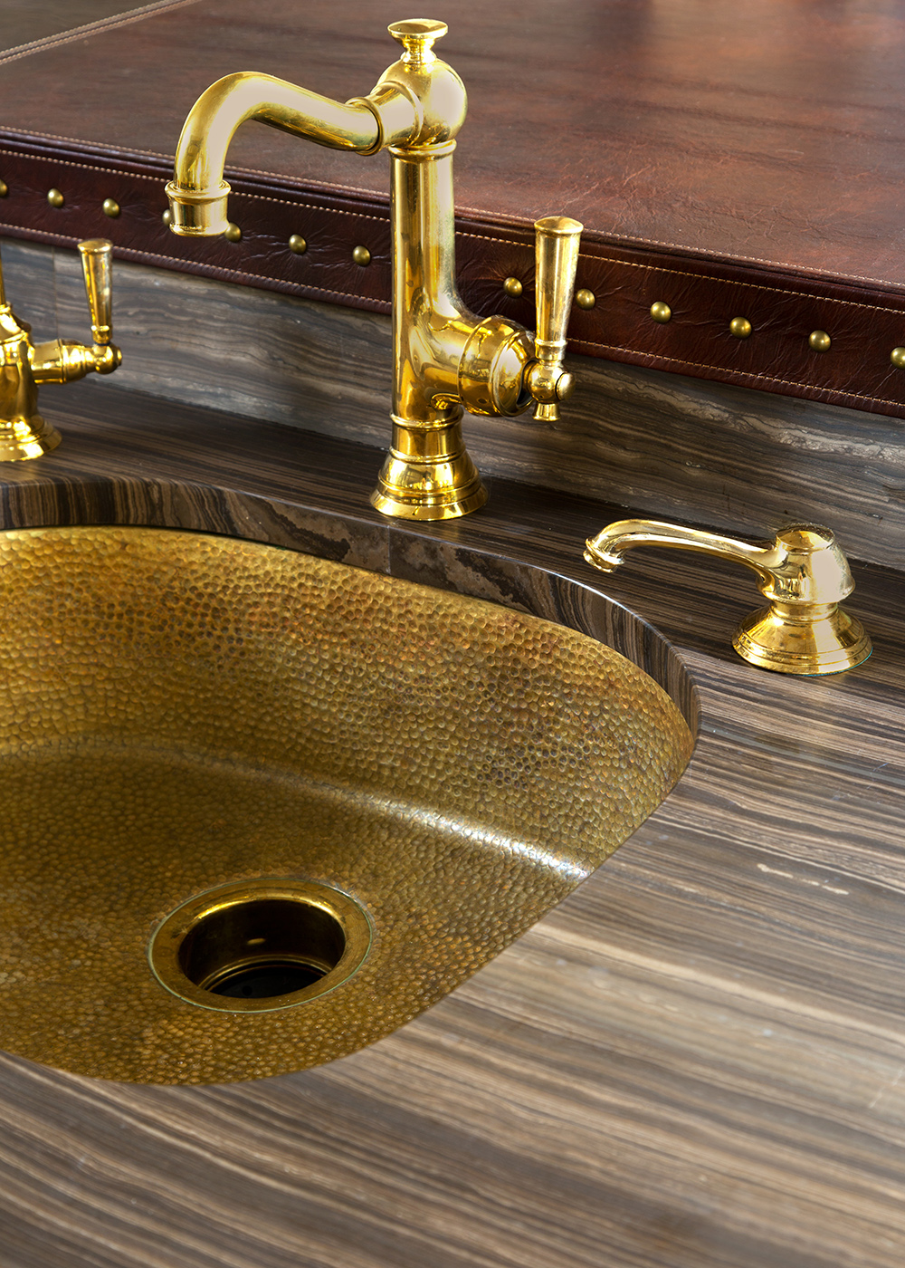 Luxury kitchen remodel featuring gold sink and faucet by William Ohs in Denver