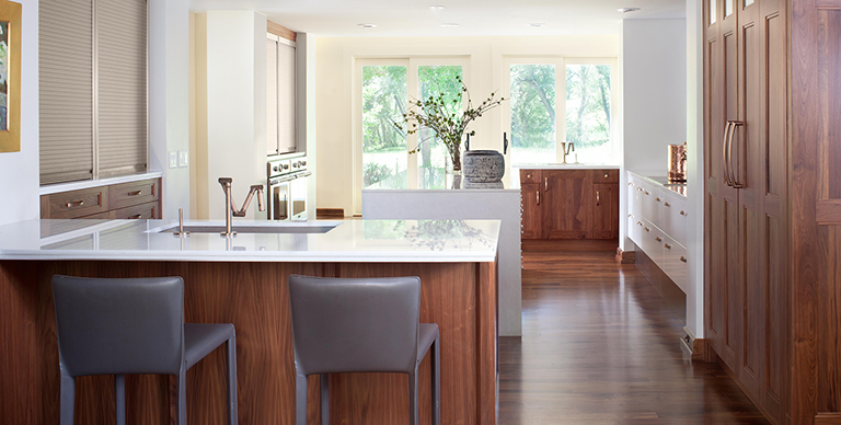 High-end kitchen cabinets with vertical wood grain by William Ohs in Denver