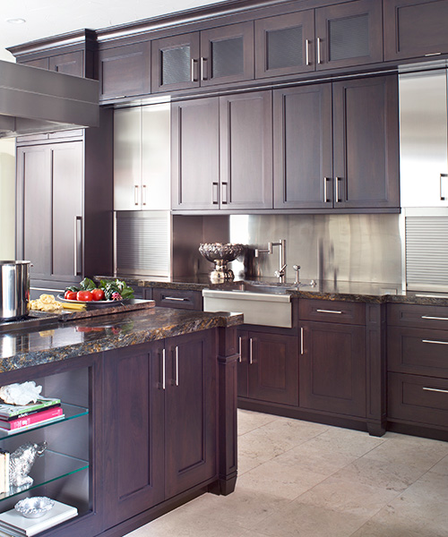 Dark wood custom cabinetry in kitchen created by William Ohs in Denver