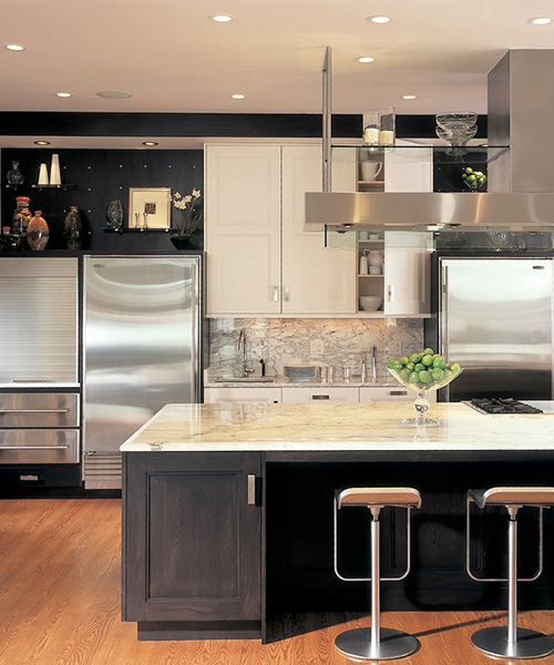 Luxury kitchen remodel with dark wood and white custom cabinetry by William Ohs in Denver