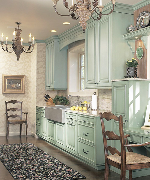 Light green custom cabinetry in kitchen by William Ohs in Denver