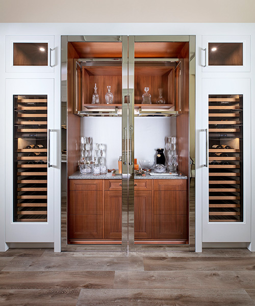 Custom built cabinets for wine cellar and wet bar by William Ohs in Denver