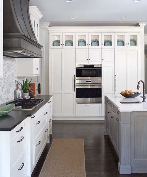 white kitchen with black countertops