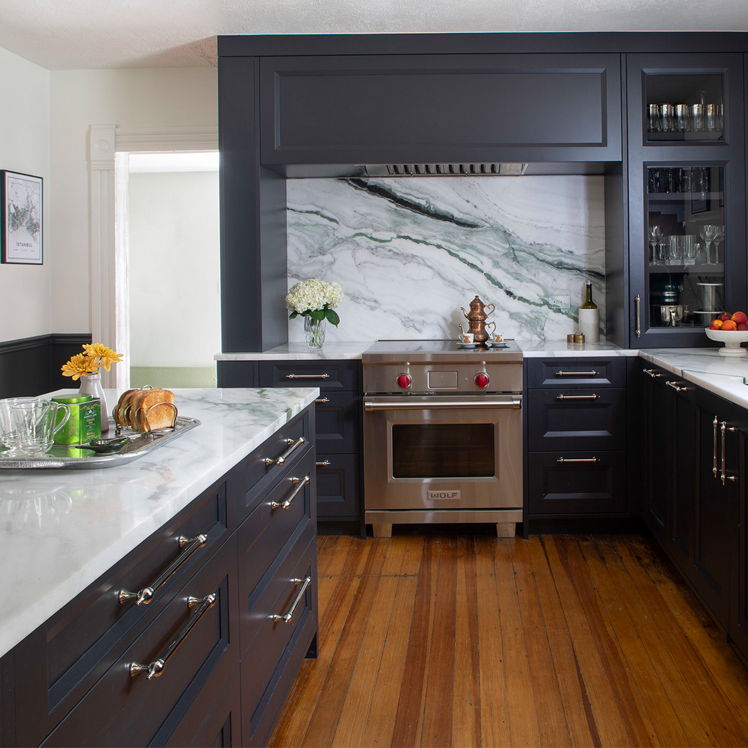 beautiful large dark cabinet kitchen with an island