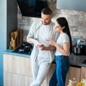 A couple in their kitchen.