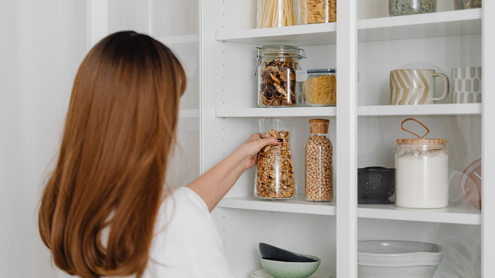 woman looking in pantry