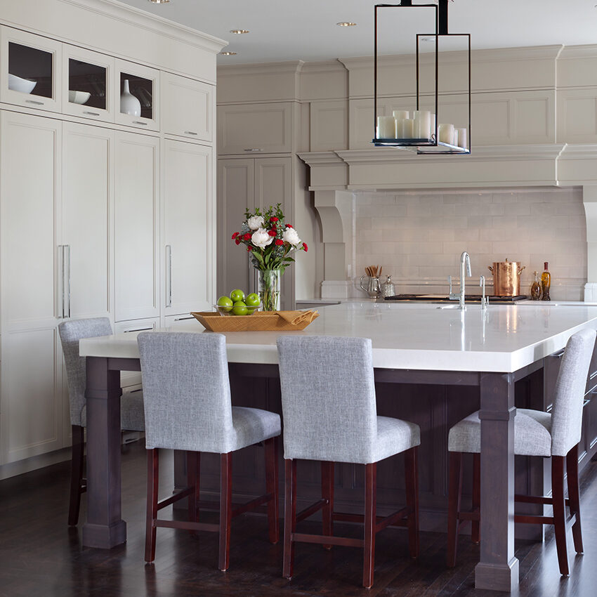 Custom kitchen design with large custom-made cabinets and a white island by William Ohs in Denver