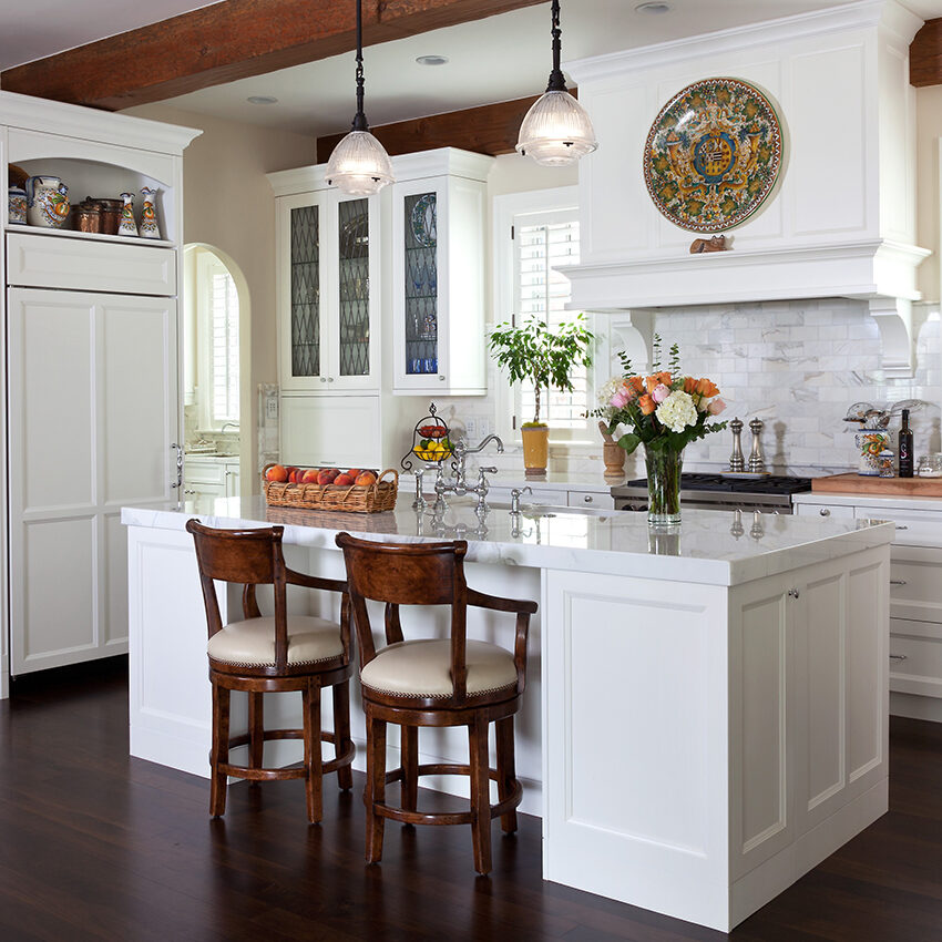 All white transitional luxury kitchen design by William Ohs in Denver featuring custom built cabinets